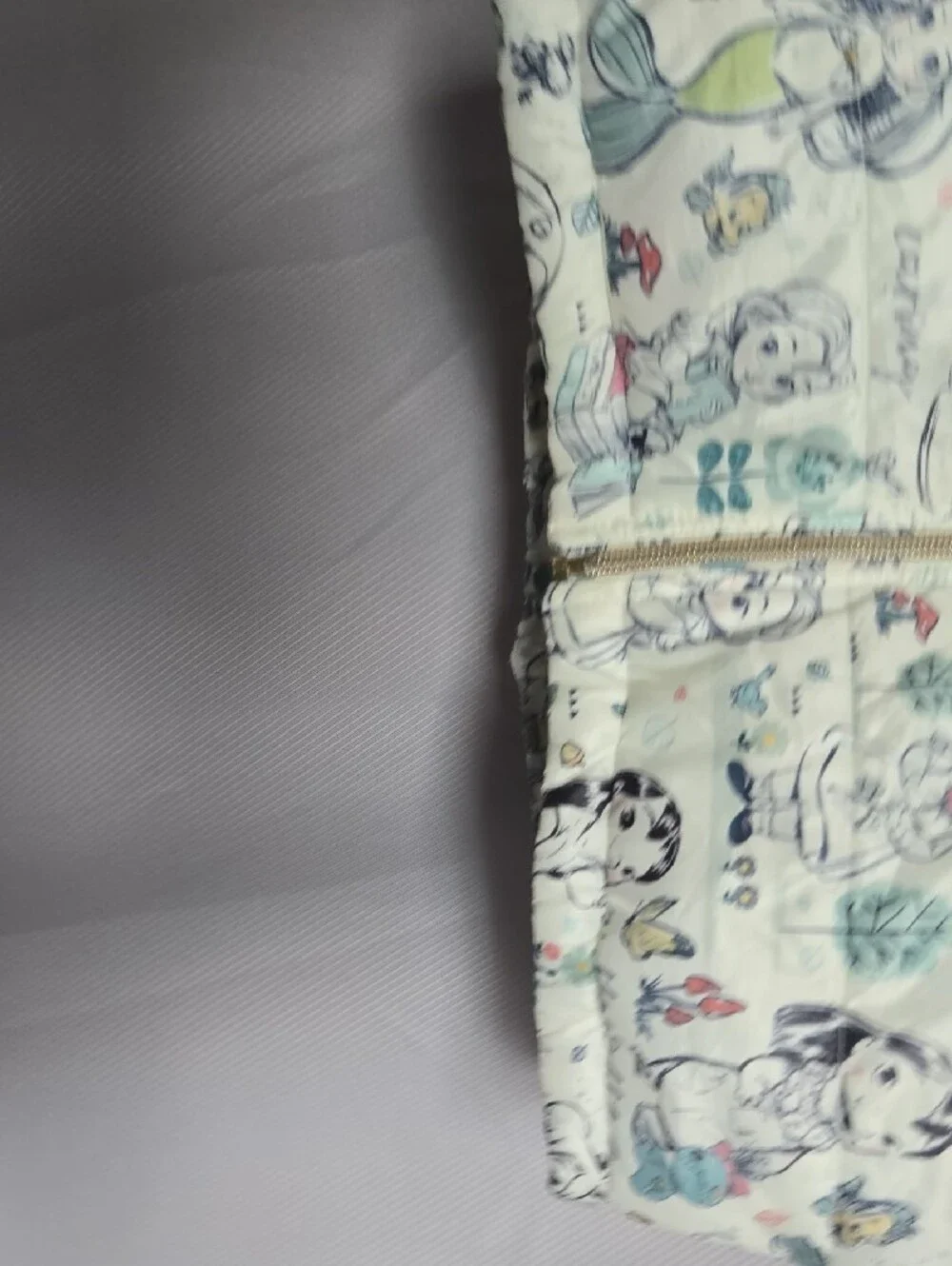 Disney Quilted Puffer Jacket with Cream Background and Pastel Accents